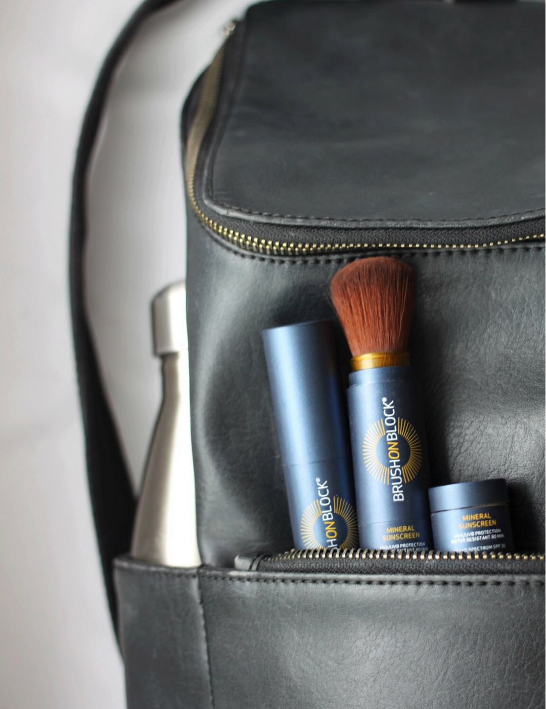 Image Brush On Block® sticking out of backpack