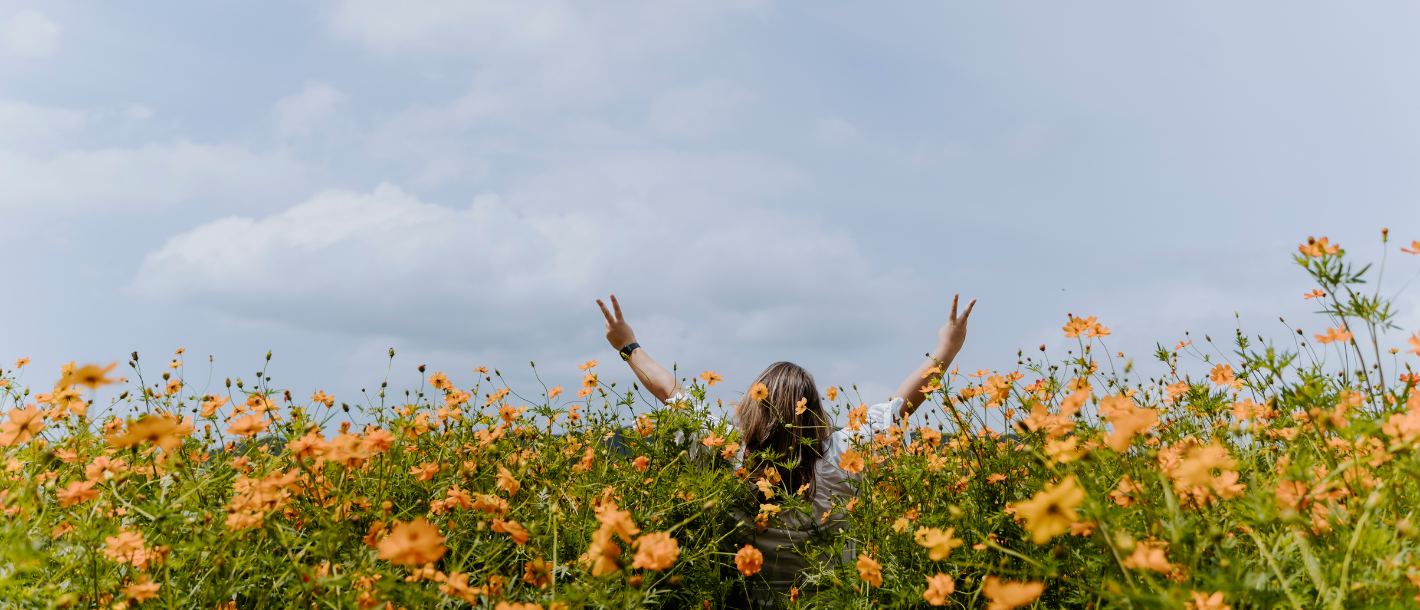 woman in a field of spring flowers