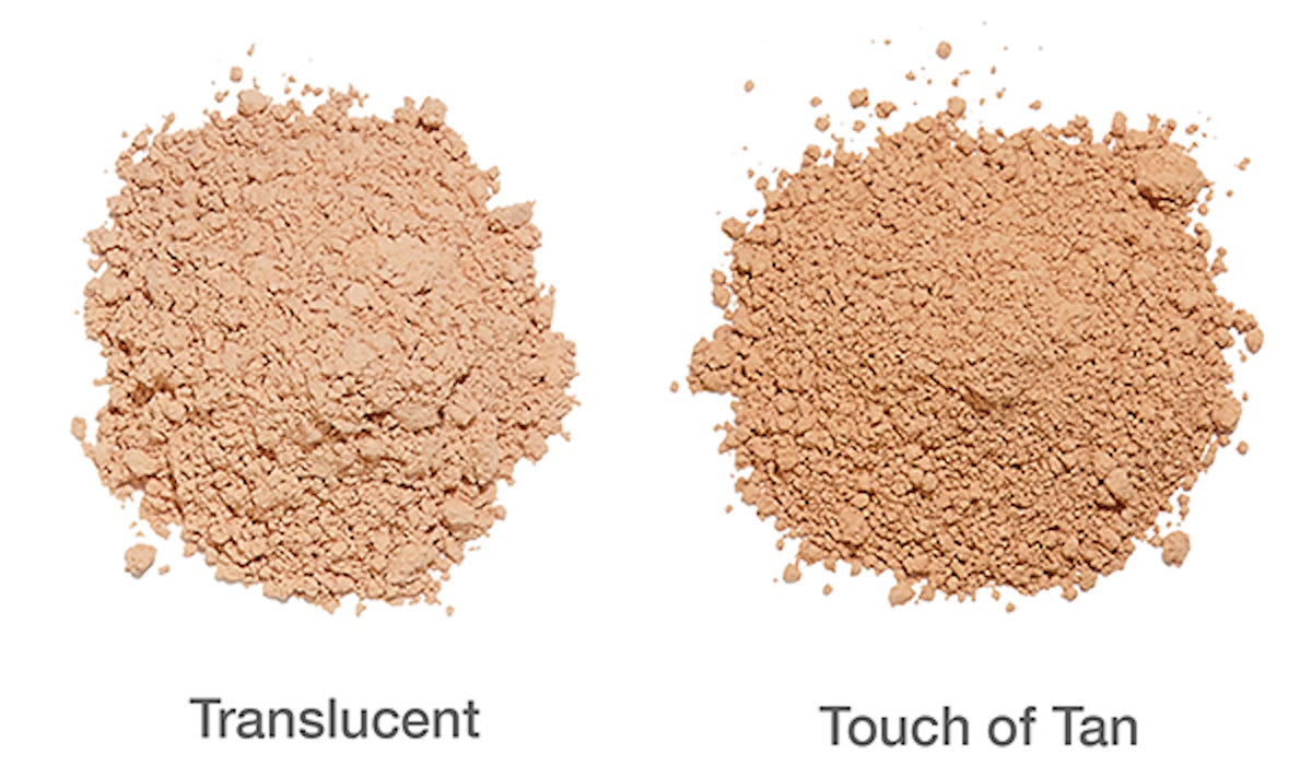 Pile of Translucent Brush On Block powder next to pile of Touch of Tan Brush On Block.