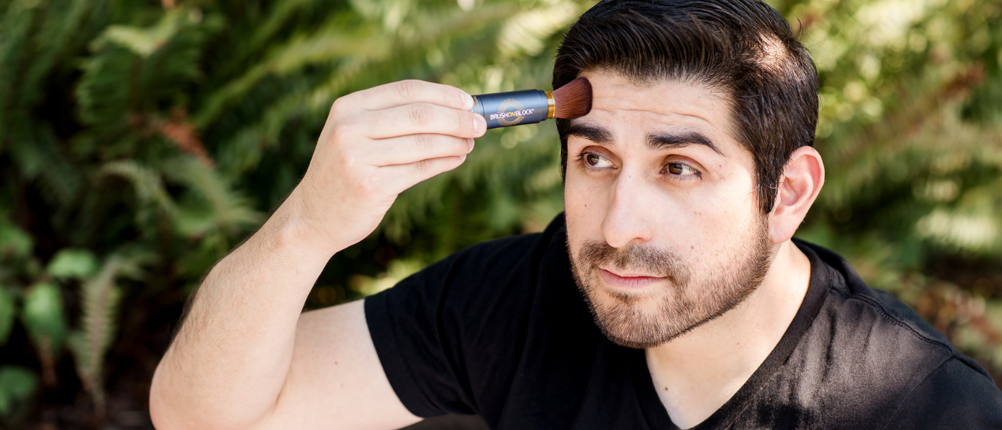 Man applying Brush On Block to face.