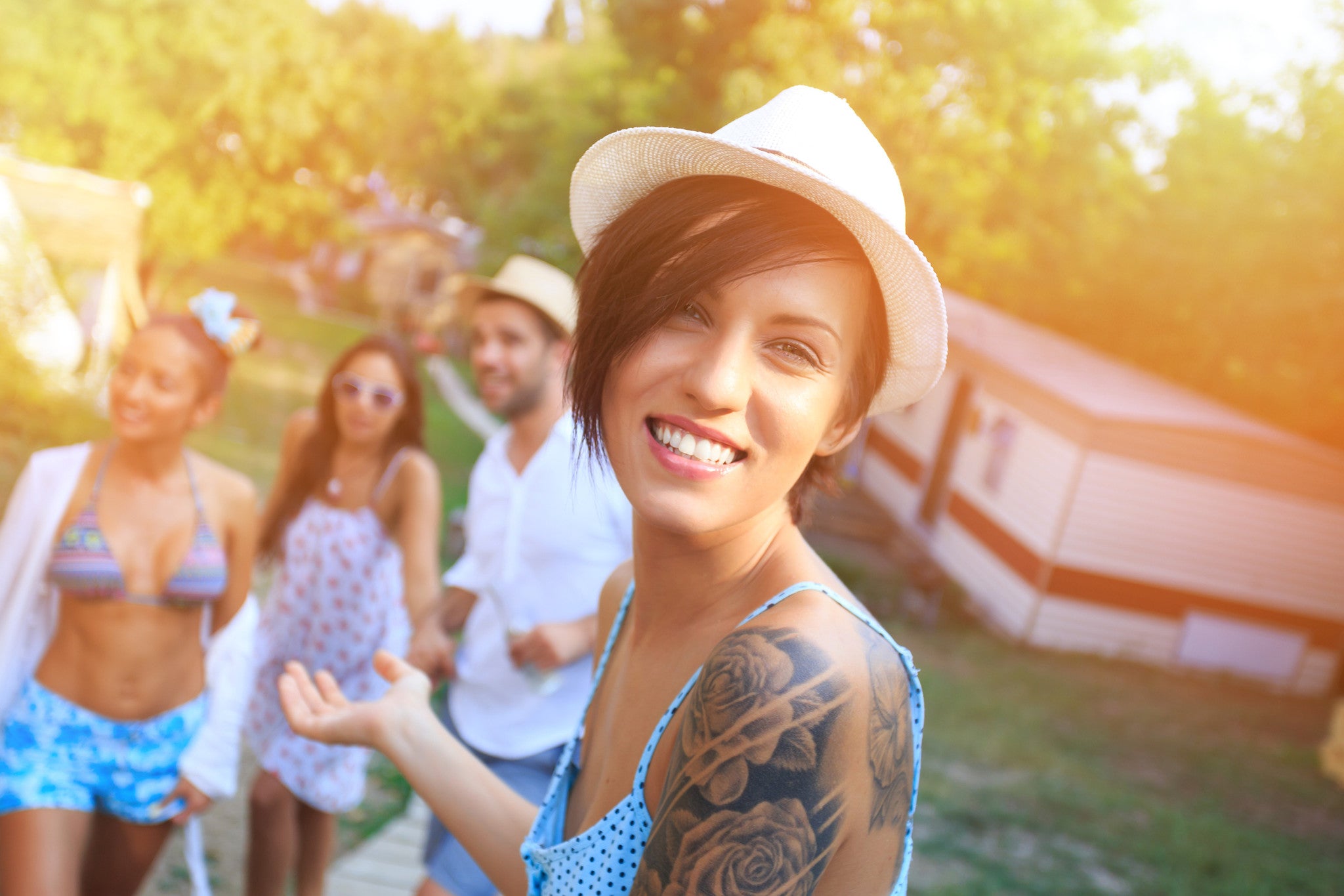 Brush On Block image of tattooed woman in the sun