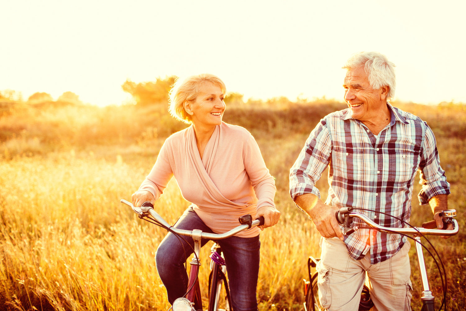 Brush On Block image of older couple riding bikes in the sun