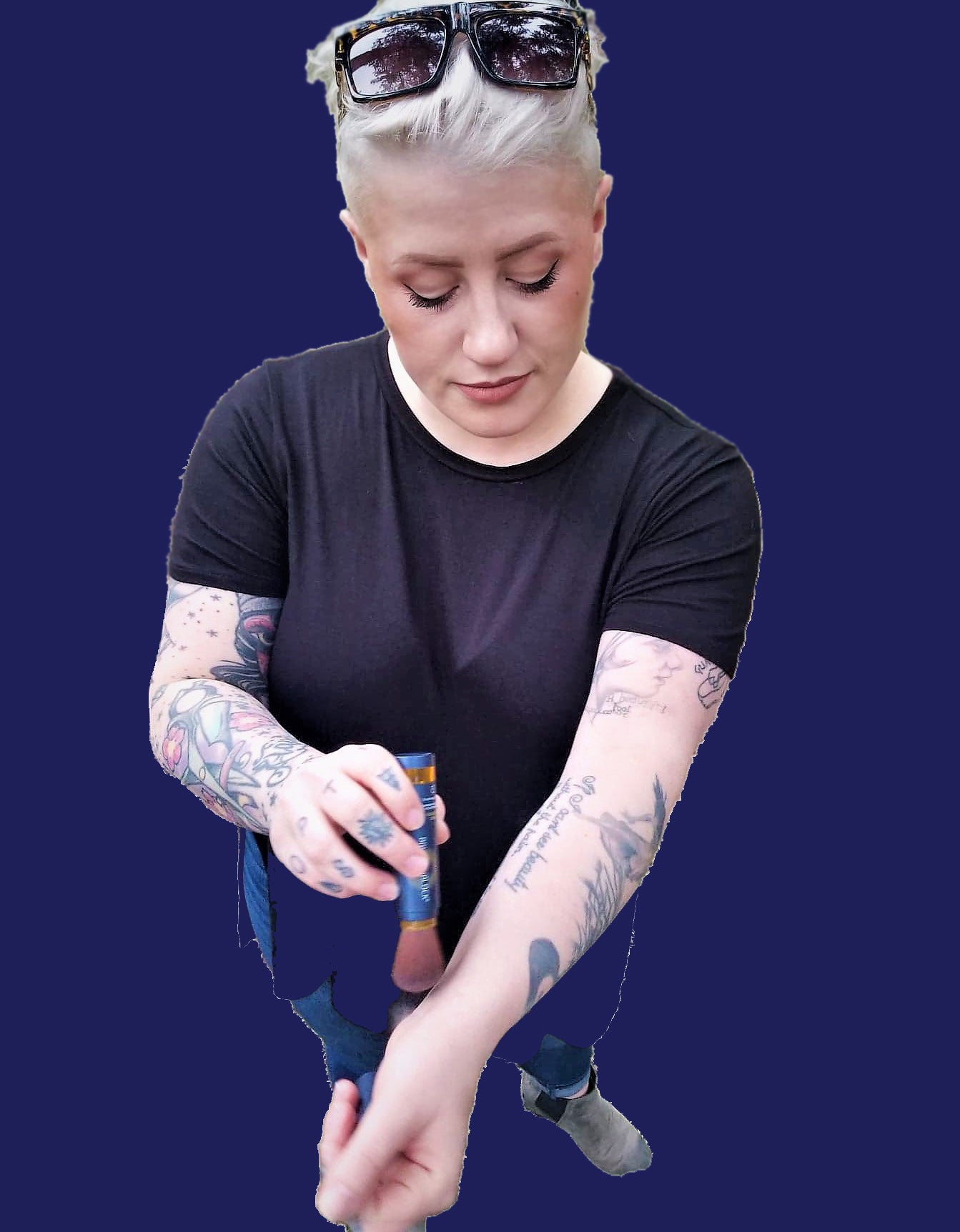 Woman applying BRUSH ON BLOCK to tattoos.