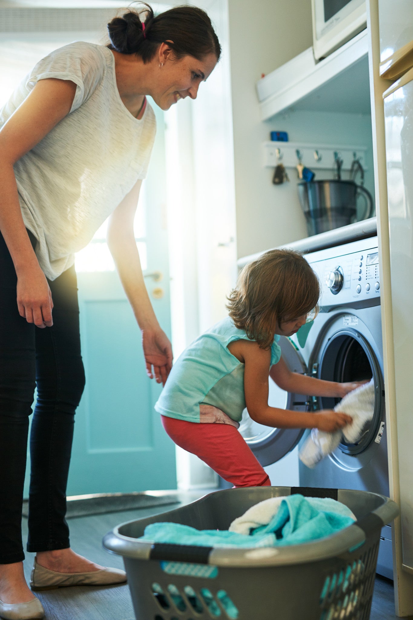 Brush On Block image of child helping mother with laundry