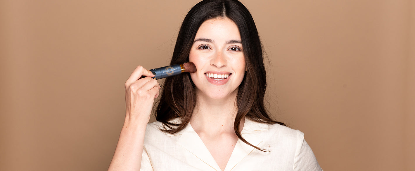 Woman applying Brush On Block to face