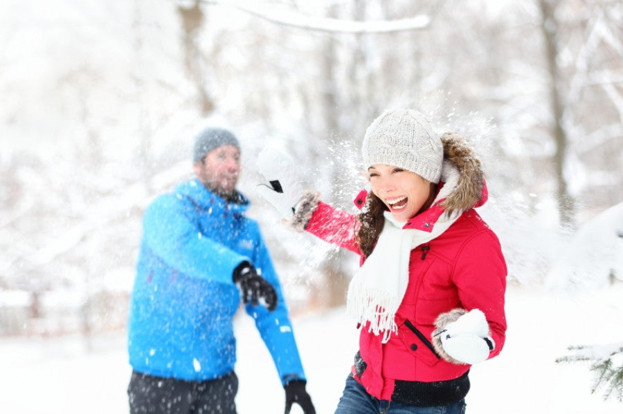 Brush On Block image of man and woman in snowball fight
