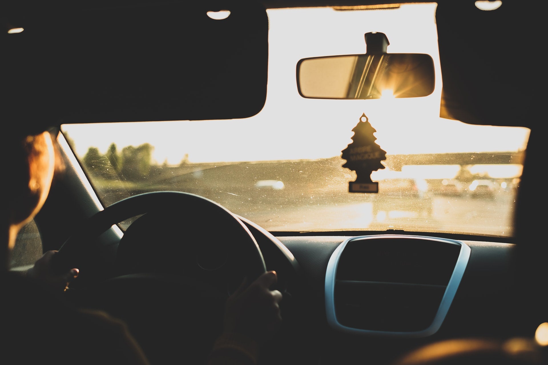 Photo by Luigi Manga on Unsplash, looking out front windshield of car