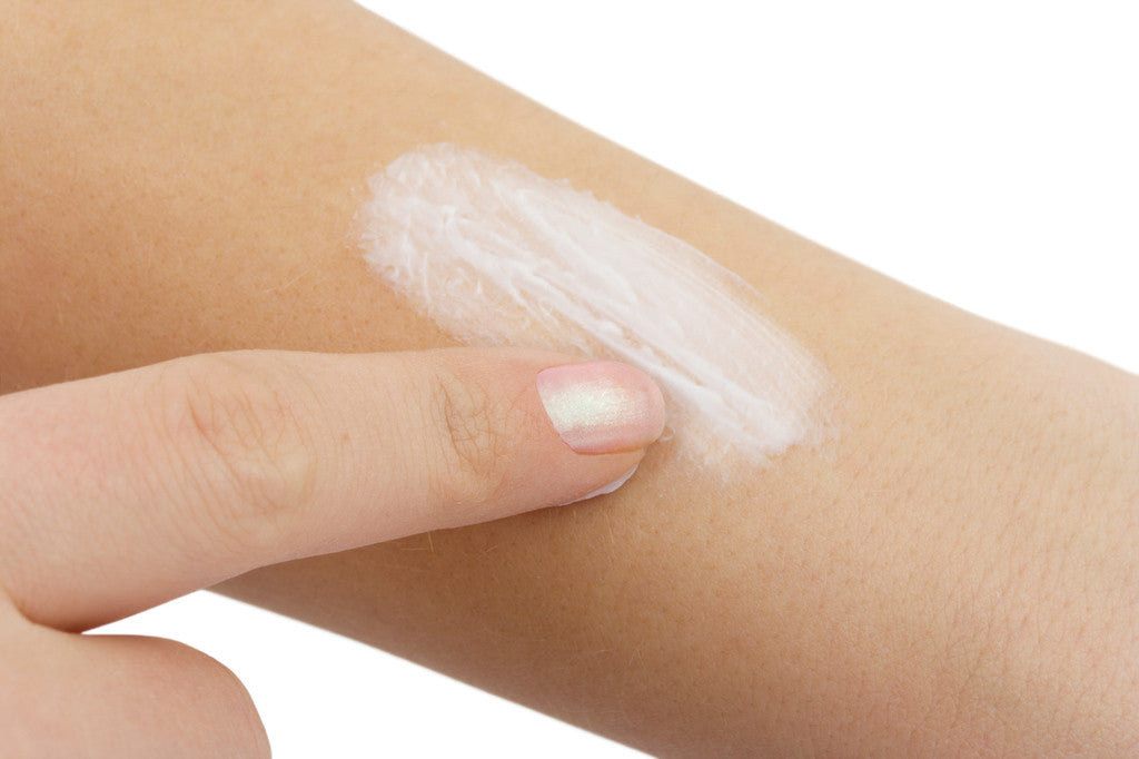 Brush On Block image of person rubbing sunscreen on arm