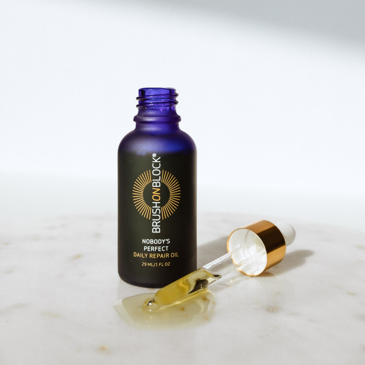 Nobody's Perfect Daily Face Oil additional view mineral sunscreen brush applicator