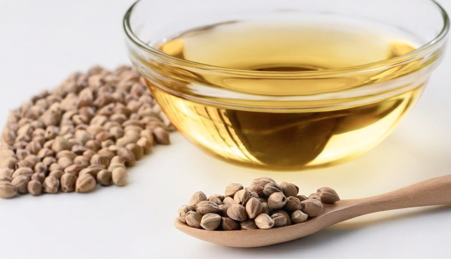 Bowl of hemp seed oil and seeds representing omega-rich hydration 