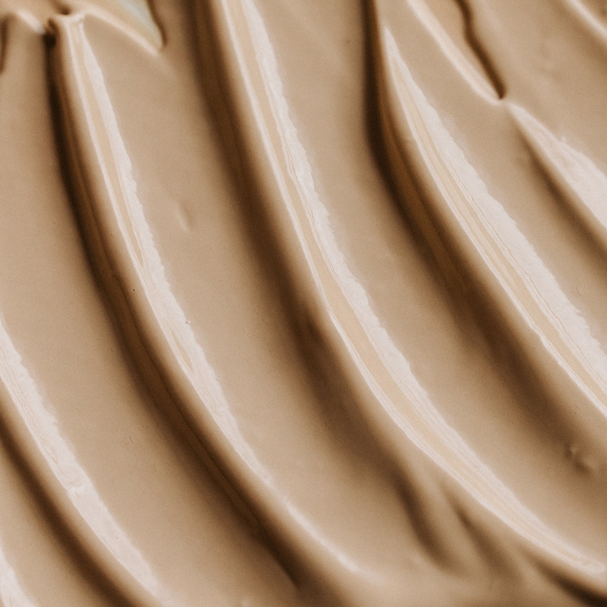 Sheer Genius SPF 50 Mineral Sunscreen + Moisture Tinted lifestyle shot mineral sunscreen brush applicator