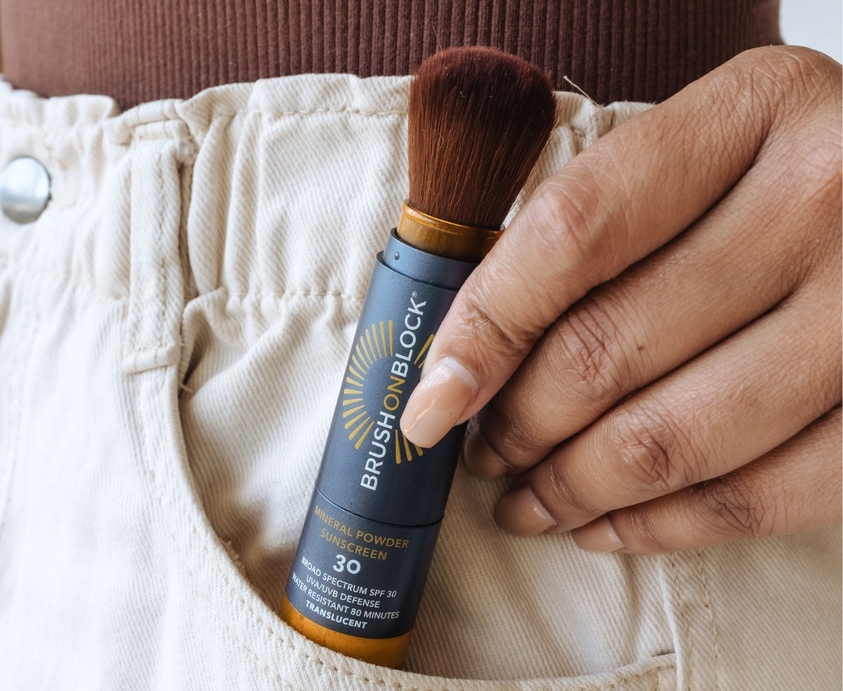 Person pulling portable Brush On Block brush out of pocket. 